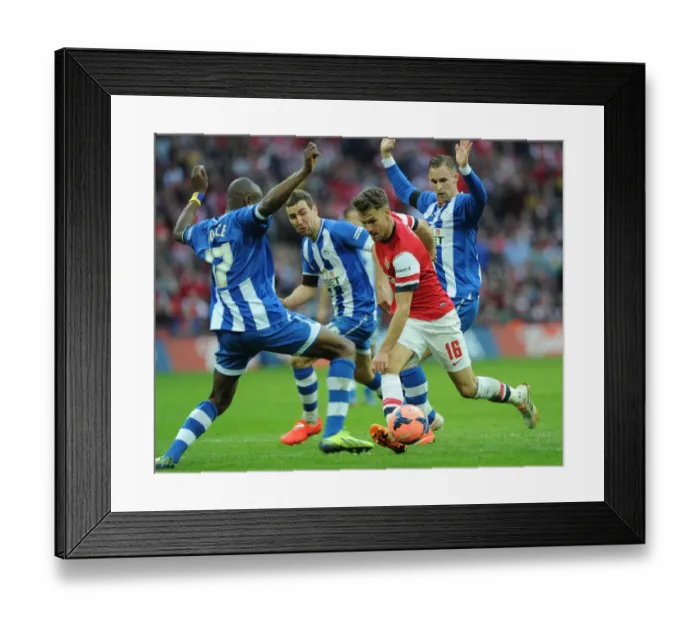 Framed Print : Arsenal's Aaron Ramsey Faces Off Against Wigan's McArthur, Boyce, and Collison in FA Cup Semi-Final Showdown