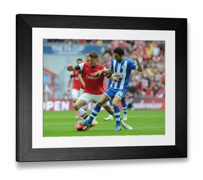 Framed Print : Arsenal's Aaron Ramsey Faces Off Against Wigan's Jordi Gomez in FA Cup Semi-Final Showdown