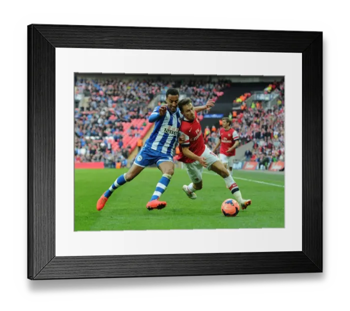 Framed Print : Arsenal's Aaron Ramsey Faces Off Against Wigan's James Perch in FA Cup Semi-Final Showdown Framed Print : Arsenal's Aaron Ramsey Faces Off Against Wigan's James Perch in FA Cup Semi-Final Showdown