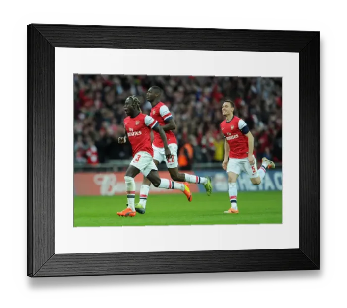 Framed Print : Bacary Sagna (Arsenal) celebrates winning the penalty shoot out. Arsenal 1: 1 Wigan Athletic