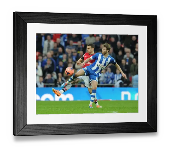 Framed Print : Arsenal's Thomas Vermaelen Faces Off Against Wigan's Nick Powell in FA Cup Semi-Final Showdown Framed Print : Arsenal's Thomas Vermaelen Faces Off Against Wigan's Nick Powell in FA Cup Semi-Final Showdown