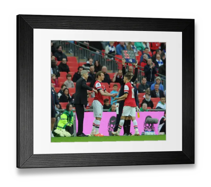 Framed Print : Arsene Wenger the Arsenal Manager subs Kim Kallstrom for Aaron Ramsey. Arsenal 1: 1 Wigan Athletic Framed Print : Arsene Wenger the Arsenal Manager subs Kim Kallstrom for Aaron Ramsey. Arsenal 1: 1 Wigan Athletic
