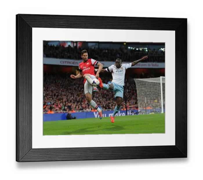 Framed Print : Giroud vs. Demel: Intense Battle at the Emirates - Arsenal v West Ham United, Premier League Framed Print : Giroud vs. Demel: Intense Battle at the Emirates - Arsenal v West Ham United, Premier League