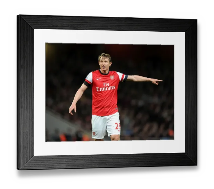 Framed Print : Arsenal's Kim Kallstrom in Action Against West Ham United (2014) Framed Print : Arsenal's Kim Kallstrom in Action Against West Ham United (2014)