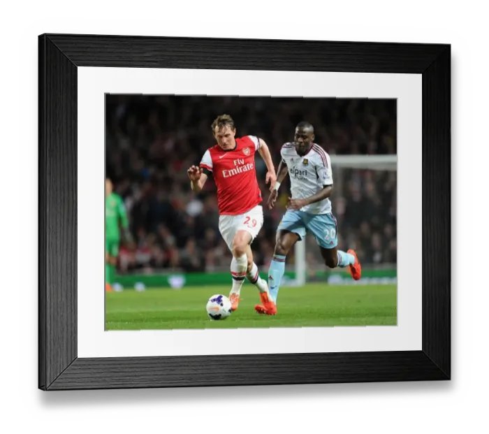 Framed Print : Arsenal's Kim Kallstrom Outmaneuvers West Ham's Guy Demel