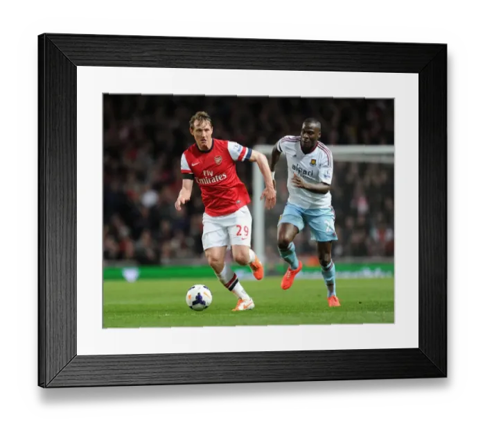 Framed Print : Arsenal's Kim Kallstrom Outwits Guy Demel: A Thrilling Moment from the Arsenal vs. West Ham Match Framed Print : Arsenal's Kim Kallstrom Outwits Guy Demel: A Thrilling Moment from the Arsenal vs. West Ham Match