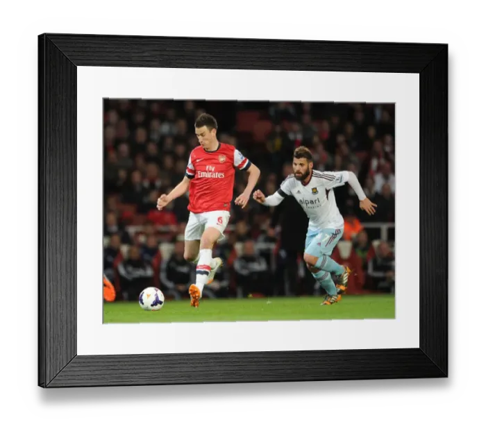 Framed Print : Clash of Titans: Koscielny vs. Nocerino - Arsenal v West Ham United, Premier League Framed Print : Clash of Titans: Koscielny vs. Nocerino - Arsenal v West Ham United, Premier League