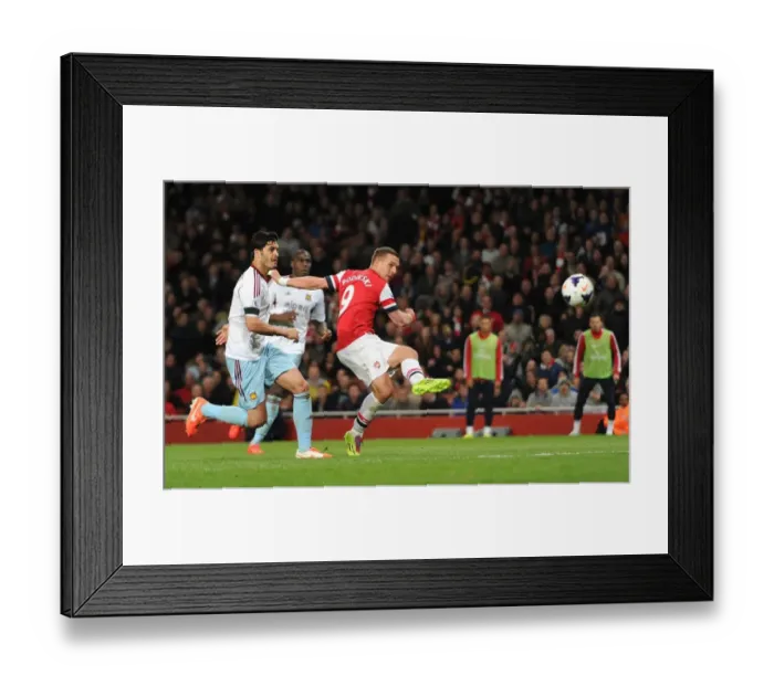 Framed Print : Lukas Podolski Scores Third Goal Past James Tomkins in Arsenal's Victory over West Ham United