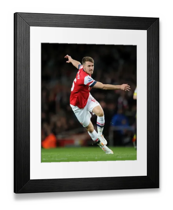 Framed Print : Aaron Ramsey in Action: Arsenal vs. West Ham United, Premier League 2013-2014