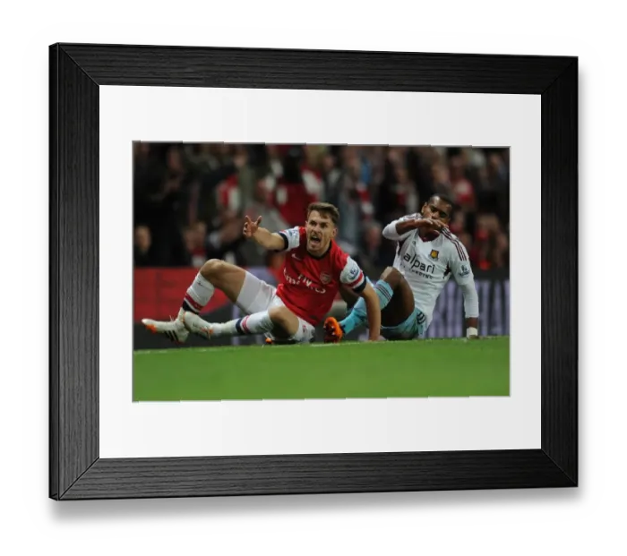 Framed Print : Intense Rivalry: Ramsey vs. Vaz Te Clash at the Emirates