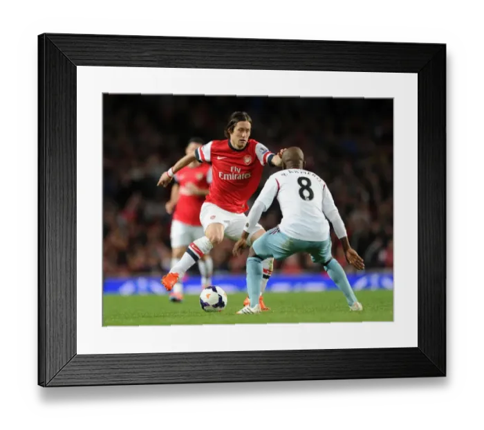 Framed Print : Arsenal's Rosicky Clashes with West Ham's Armero in Premier League Showdown
