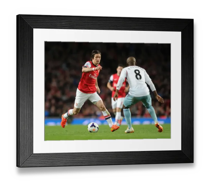 Framed Print : Intense Clash: Rosicky vs. Armero - Premier League Battle at Emirates Stadium