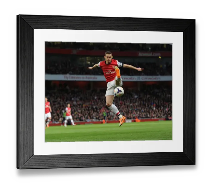 Framed Print : Thomas Vermaelen Focuses in Arsenal's Battle Against West Ham United (2013 / 14) Framed Print : Thomas Vermaelen Focuses in Arsenal's Battle Against West Ham United (2013 / 14)