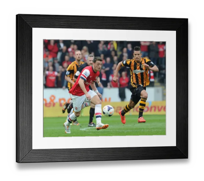 Framed Print : Mesut Ozil Outpaces Jake Livermore: Arsenal's Agile Midfielder Outruns Hull City Defender