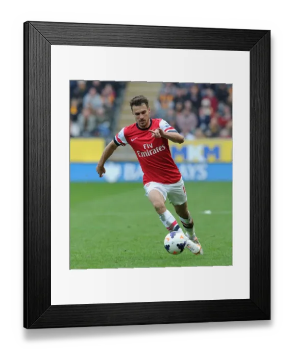 Framed Print : Aaron Ramsey in Action: Arsenal's Midfield Maestro Shines Against Hull City (2013-2014) Framed Print : Aaron Ramsey in Action: Arsenal's Midfield Maestro Shines Against Hull City (2013-2014)