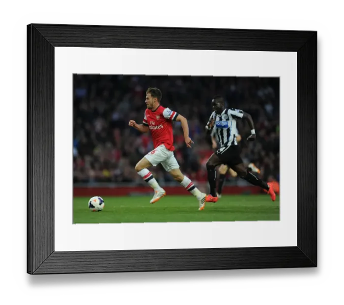 Framed Print : Ramsey Outpaces Tiote: Intense Rivalry in Arsenal vs. Newcastle United, Premier League, 2013 / 14