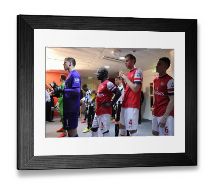 Framed Print : Arsenal's Unbeatable Defense: Szczesny, Sagna, Mertesacker, and Koscielny Secure 2:0 Victory Over Newcastle