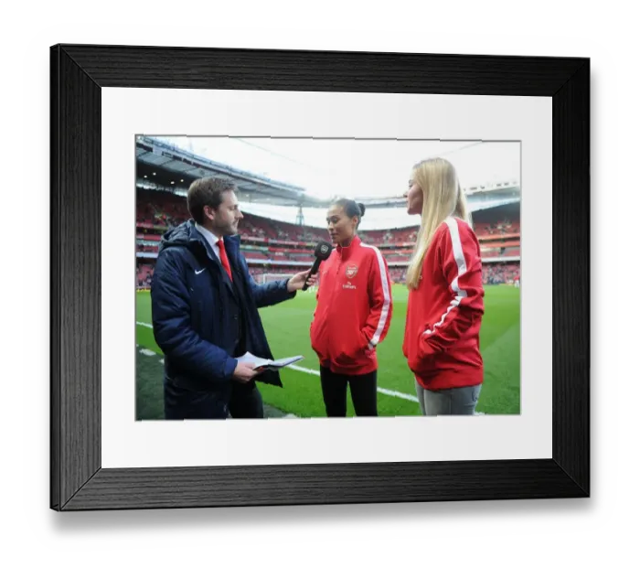 Framed Print : Rachel Yankey and Anouk Hoogendijk of the Arsenal Ladies are interviewed before the match