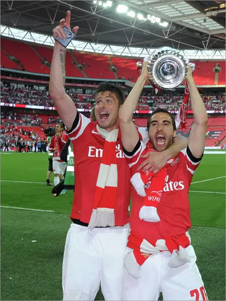 Arsenal FC Celebrates FA Cup Victory: Olivier Giroud and Mathieu Flamini with the Trophy