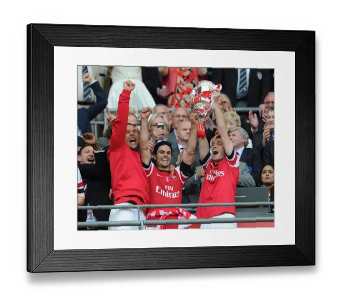 Framed Print : Arsenal Triumphs in FA Cup Final: Lukas Podolski, Mikel Arteta, and Thomas Vermaelen Lift the Trophy