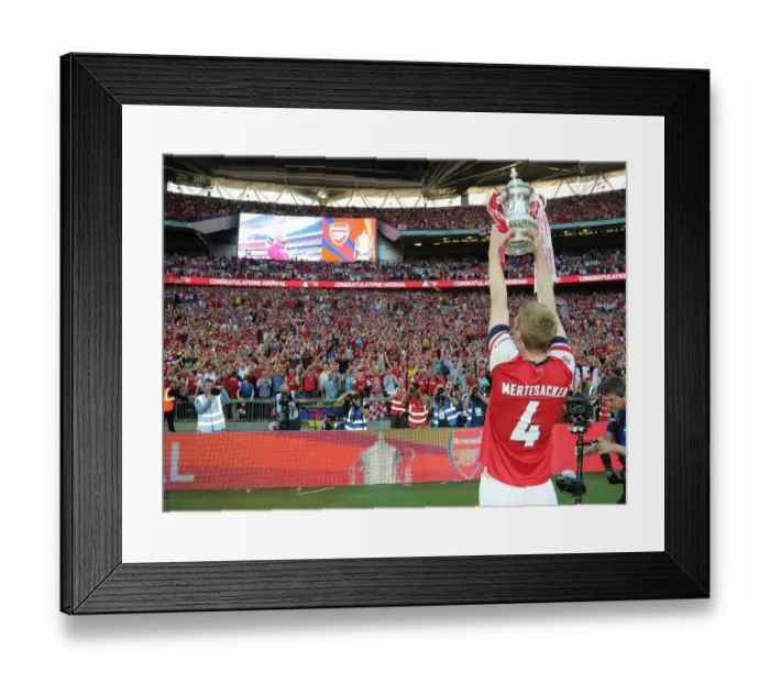 Framed Print : Per Mertesacker's Triumph: Arsenal's FA Cup Victory at Wembley