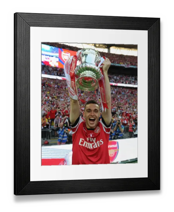 Framed Print : Arsenal's FA Cup Victory: Thomas Vermaelen Lifts the Trophy after Defeating Hull City