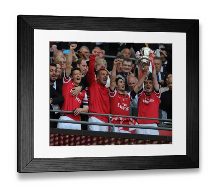 Framed Print : Arsenal FC Celebrates FA Cup Victory: Mesut Ozil, Lukas Podolski, Mikel Arteta, and Thomas Vermaelen Lift the Trophy