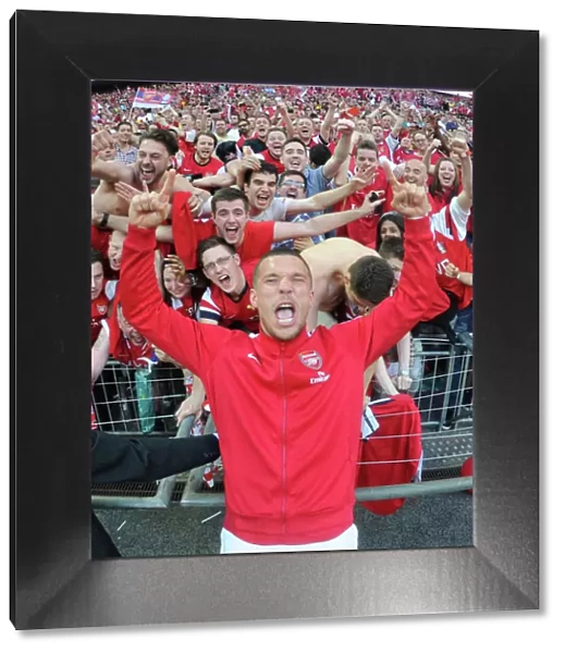 Arsenal FC: Celebrating FA Cup Victory with Lukas Podolski and Fans at Wembley Stadium