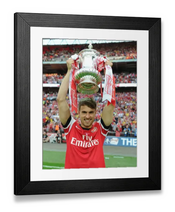 Framed Print : Arsenal's Aaron Ramsey Lifts FA Cup after Victory over Hull City Framed Print : Arsenal's Aaron Ramsey Lifts FA Cup after Victory over Hull City
