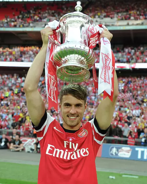 Arsenal's FA Cup Victory: Aaron Ramsey Lifts the Trophy after Defeating Hull City