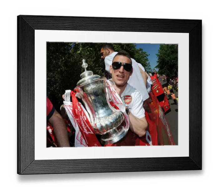 Framed Print : Arsenal FC: Celebrating FA Cup Victory - Laurent Koscielny's Triumphant Parade