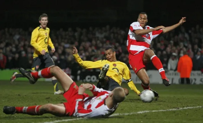 Framed Print : I. Gilberto scores Arsenals 2nd goal under pressure from Sam Oji (Doncaster)