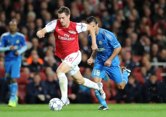 Framed Print : Aaran Ramsey (Arsenal) Jeremy Morel (Marseille). Arsenal 0: 0 Marseille