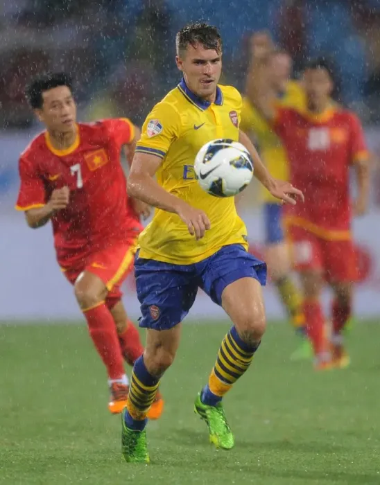 Framed Print : Aaron Ramsey in Action: Vietnam vs. Arsenal (2013-14) Framed Print : Aaron Ramsey in Action: Vietnam vs. Arsenal (2013-14)