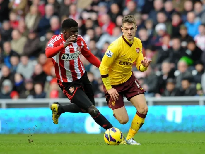 Framed Print : Aaron Ramsey (Arsenal) Alfred N Diaye (Sunderland). Sunderland 0: 1 Arsenal. Barclays Premier League Framed Print : Aaron Ramsey (Arsenal) Alfred N Diaye (Sunderland). Sunderland 0: 1 Arsenal. Barclays Premier League