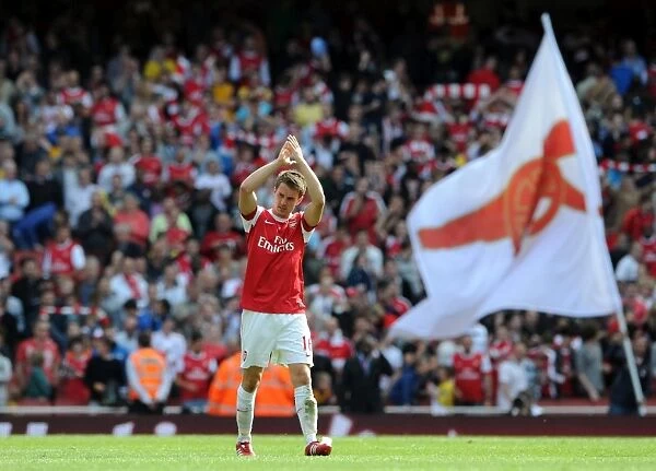 Aaron Ramsey (Arsenal) clpas the fans at the end of the match. Arsenal 1