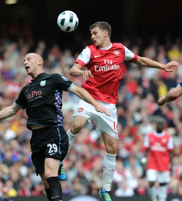 Framed Print : Aaron Ramsey (Arsenal) James Collins (Aston Villa). Arsenal 1: 2 Aston Villa