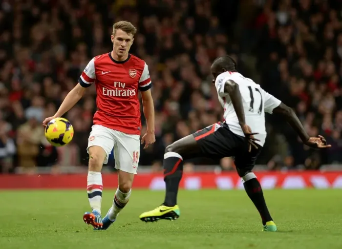 Framed Print : Aaron Ramsey (Arsenal) Mamadou Sakho (Liverpool). Arsenal 2: 0 Arsenal. Barclays Premier League