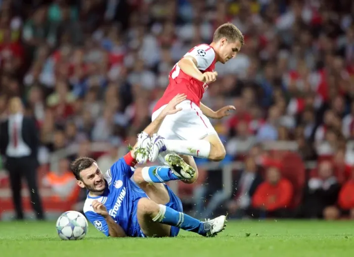 Framed Print : Aaron Ramsey (Arsenal) Vassilis Torossidis (Olympiacos). Arsenal 2: 1 Olympiacos Framed Print : Aaron Ramsey (Arsenal) Vassilis Torossidis (Olympiacos). Arsenal 2: 1 Olympiacos
