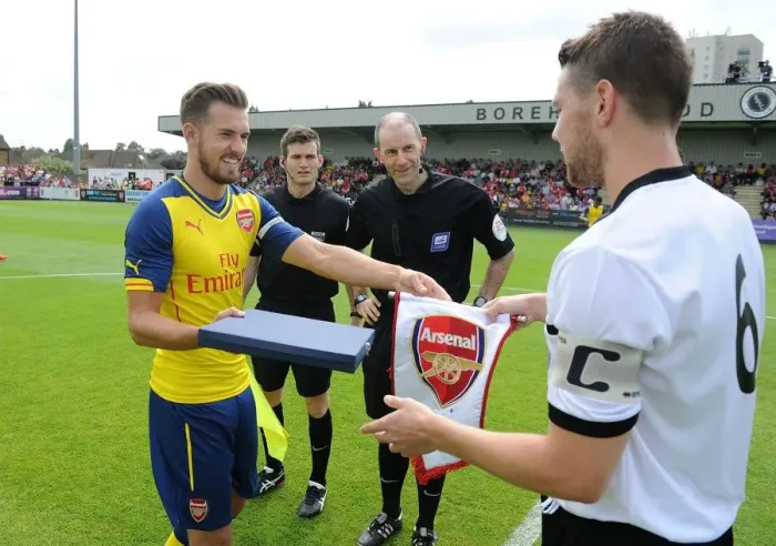 Framed Print : Aaron Ramsey and Callum Reynolds Exchange Gifts: Boreham Wood vs. Arsenal Pre-Season Friendly Framed Print : Aaron Ramsey and Callum Reynolds Exchange Gifts: Boreham Wood vs. Arsenal Pre-Season Friendly