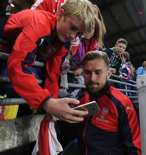 Aaron Ramsey Celebrates with Arsenal Fans after Winning against Viking FK in Norway