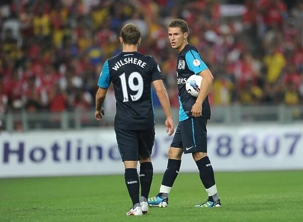 Aaron Ramsey and Jack Wilshere (Arsenal). Malaysia XI 0: 4 Arsenal, Bukit Jalil Stadium