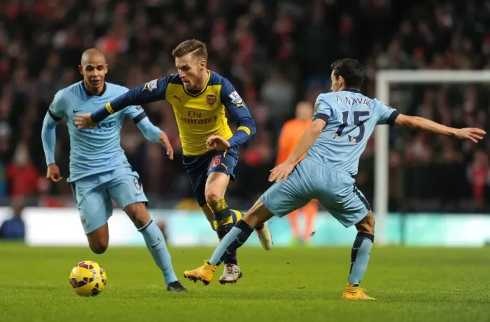 Framed Print : Aaron Ramsey Outmaneuvers Jesus Navas and Fernando: Manchester City vs Arsenal, Premier League 2014-15 (Photo) Framed Print : Aaron Ramsey Outmaneuvers Jesus Navas and Fernando: Manchester City vs Arsenal, Premier League 2014-15 (Photo)