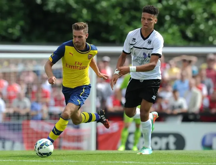 Framed Print : Aaron Ramsey Outmaneuvers Lee Angol in Arsenal's Pre-Season Friendly against Borehamwood Framed Print : Aaron Ramsey Outmaneuvers Lee Angol in Arsenal's Pre-Season Friendly against Borehamwood