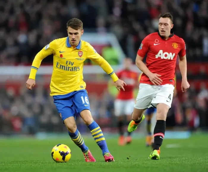 Framed Print : Aaron Ramsey Outmaneuvers Phil Jones: Manchester United vs. Arsenal, Premier League, 2013