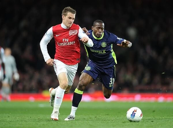 Aaron Ramsey Outsmarts Maynor Figueroa: Arsenal's Masterclass in the 2012 Match against Wigan