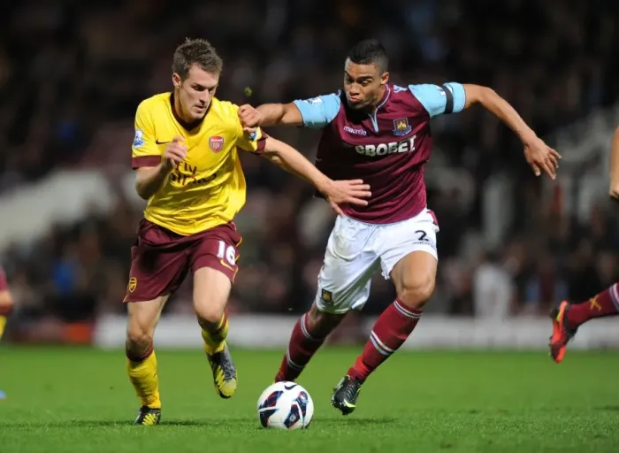 Framed Print : Aaron Ramsey Outsmarts Winston Reid: Premier League Battle Framed Print : Aaron Ramsey Outsmarts Winston Reid: Premier League Battle