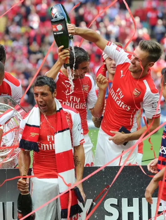 Framed Print : Aaron Ramsey and Santi Cazorla (Arsenal) celebrate winning the community shield. Arsenal 3