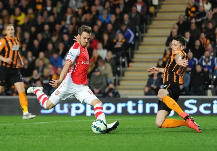 Framed Print : Aaron Ramsey scores Arsenals 2nd goal under pressure from Robbie Brady (Hull) Framed Print : Aaron Ramsey scores Arsenals 2nd goal under pressure from Robbie Brady (Hull)