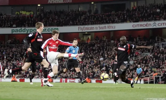 Framed Print : Aaron Ramsey Scores Arsenal's Second Goal Against Stoke City Amidst Pressure from Abdoulaye Faye and Danny Collins